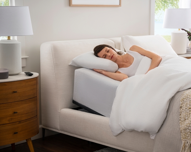 Woman laying on RestorePlus Mattress