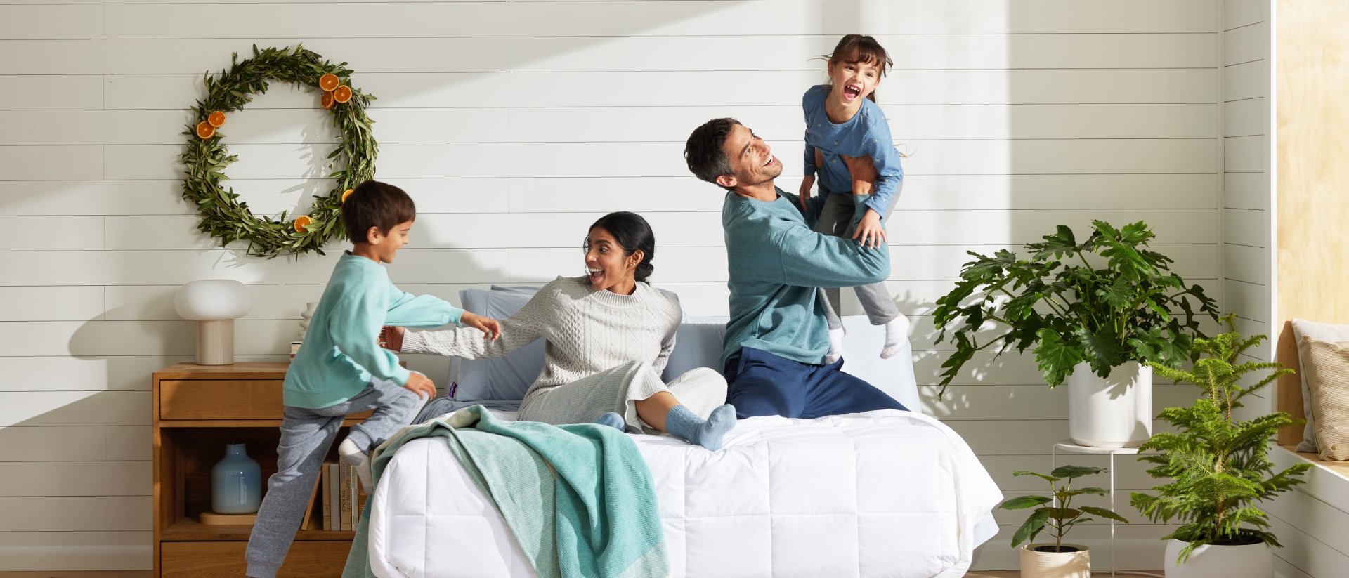 Family on a Purple bed